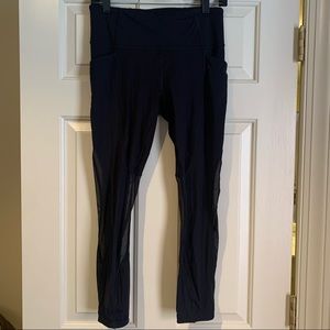 Lululemon black tight with mesh cutouts, size 8